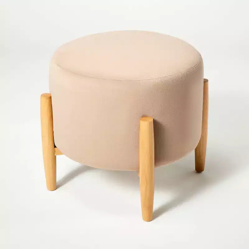 Ottoman rond en velours avec pieds en bois